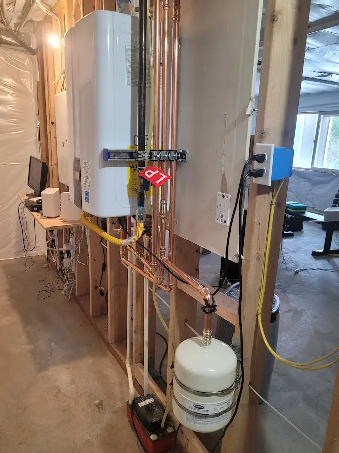 Licensed plumber repairing a kitchen sink in Fitchburg